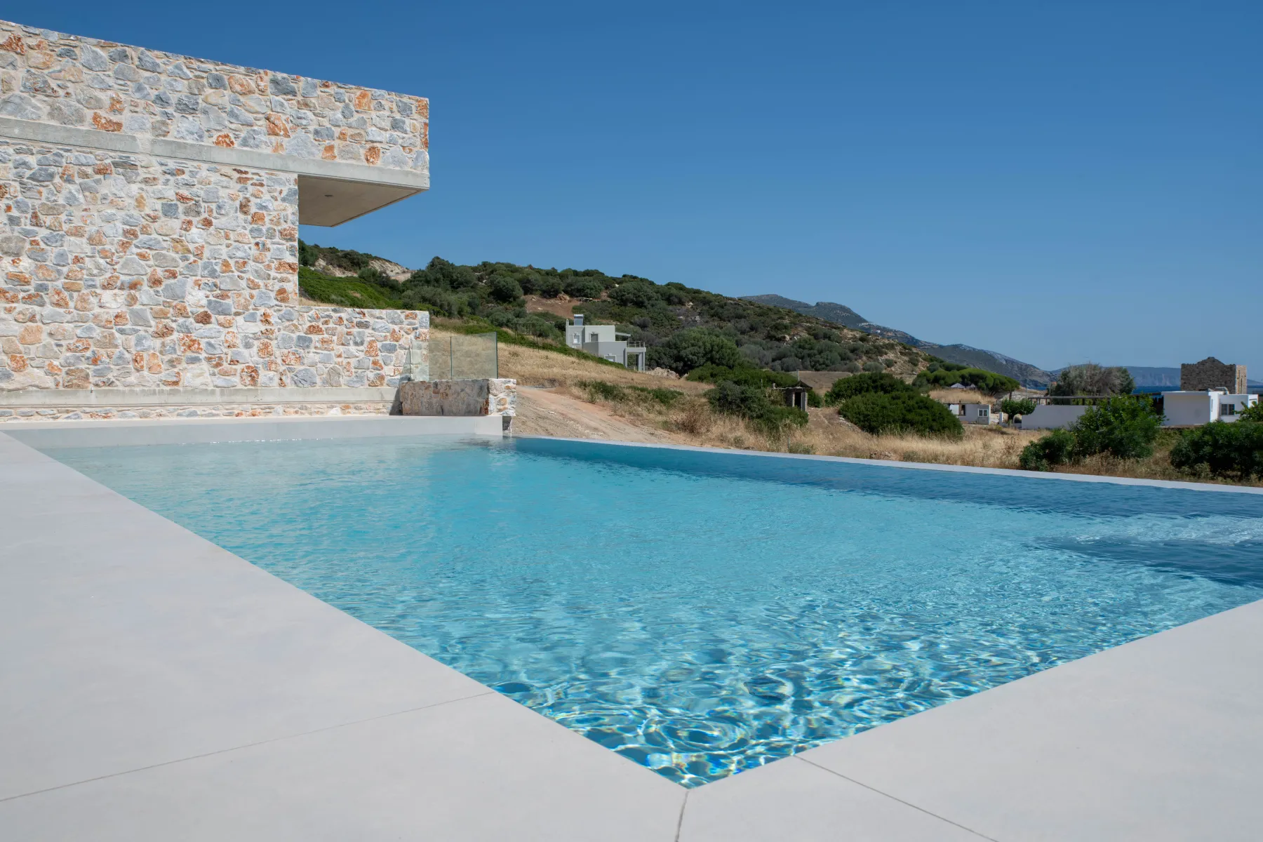 Stone wall and pool with sea view